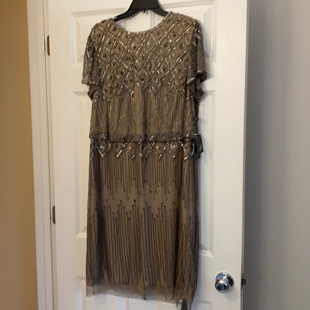 New tags on beaded formal knee length dress